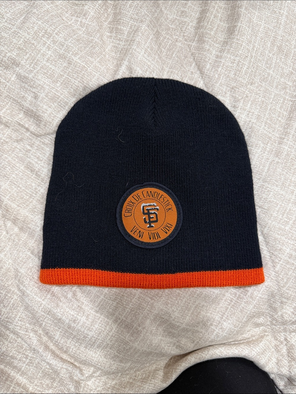 Icebreaker Kids Black Beanie with Orange Trim and Team Patch